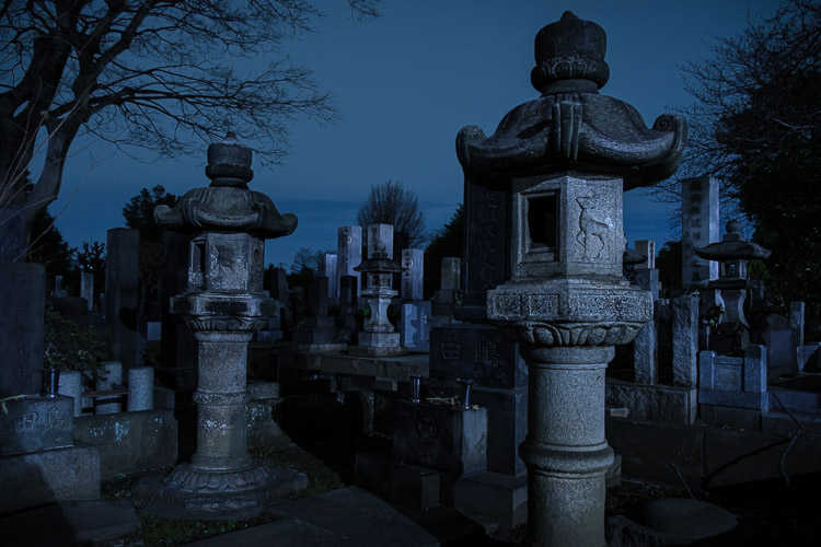 night photo of a graveyard with exposure compensation applied to correct it