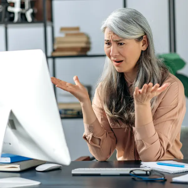 Frustrated woman trying to learn Lightroom